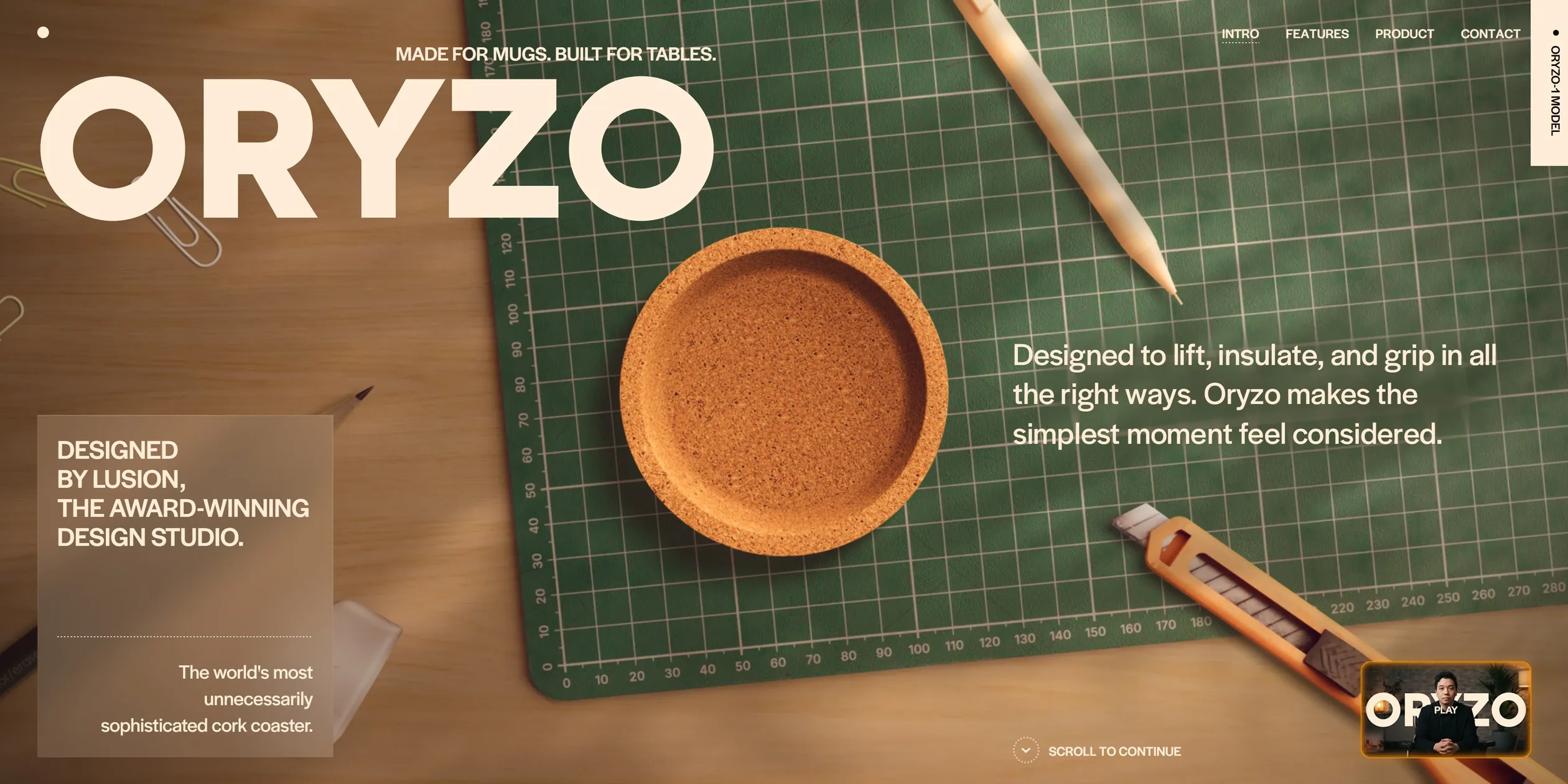 The first screen is a top-down shot of a work desk. An orange-brown cork coaster sits in the middle of a green cutting mat with crisp grid lines and ruler marks, a pale pencil lies at an angle in the upper right, an orange utility knife sits in the lower right and paper clips lie at the left edge. The large cream ORYZO under MADE FOR MUGS. BUILT FOR TABLES. fills the top left, a frosted card in the bottom left reads DESIGNED BY LUSION, THE AWARD-WINNING DESIGN STUDIO, and the founder video thumbnail sits in the bottom right