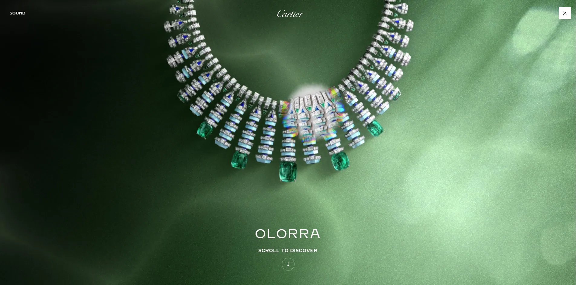 After choosing the emerald: the screen fills with green caustics and the necklace hangs at centre