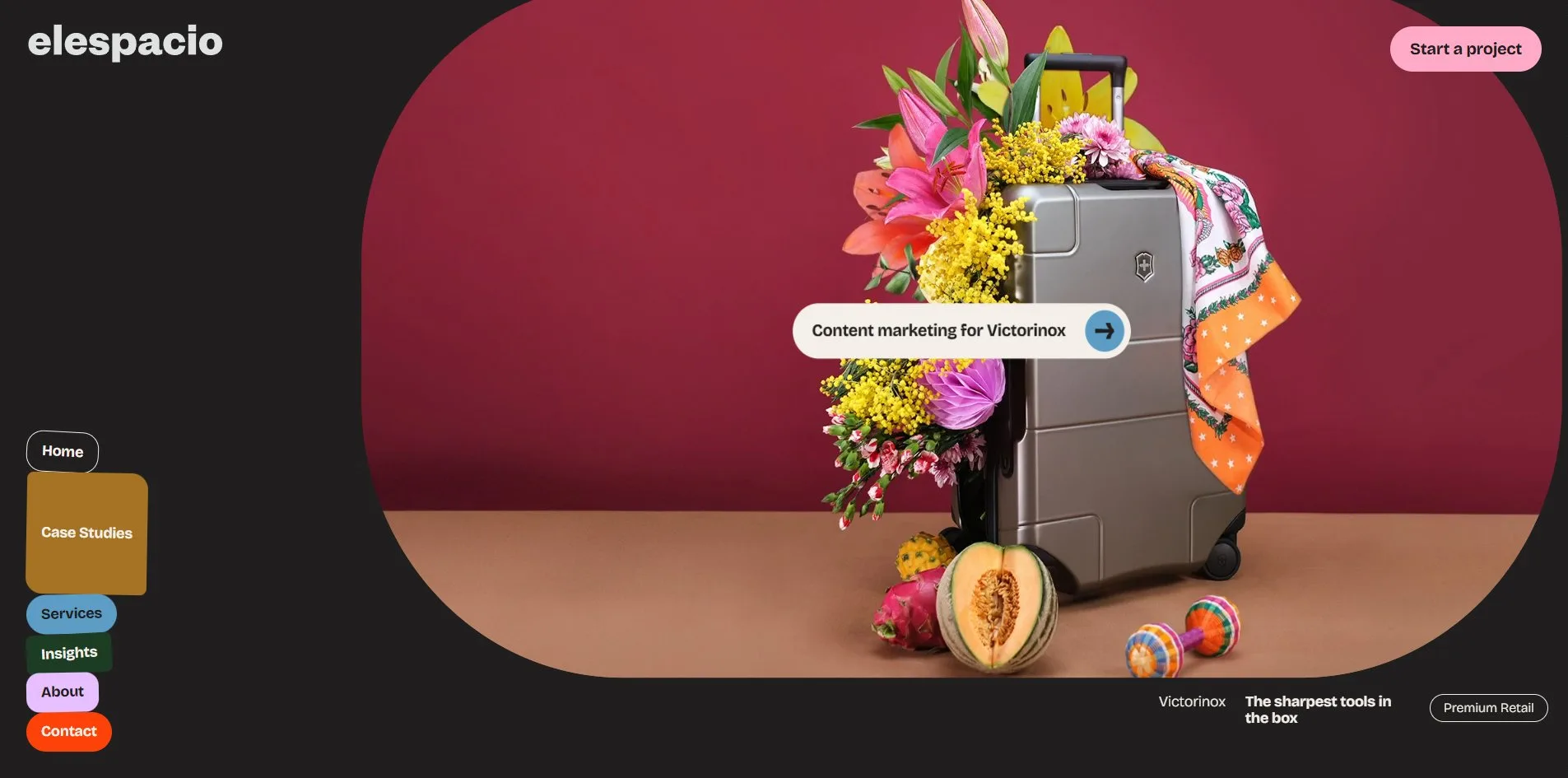 The first card of the case studies page, a silver suitcase overflowing with flowers on a wine red ground, its corners rounded off under the cursor, and a capsule reading Content marketing for Victorinox floating at its centre