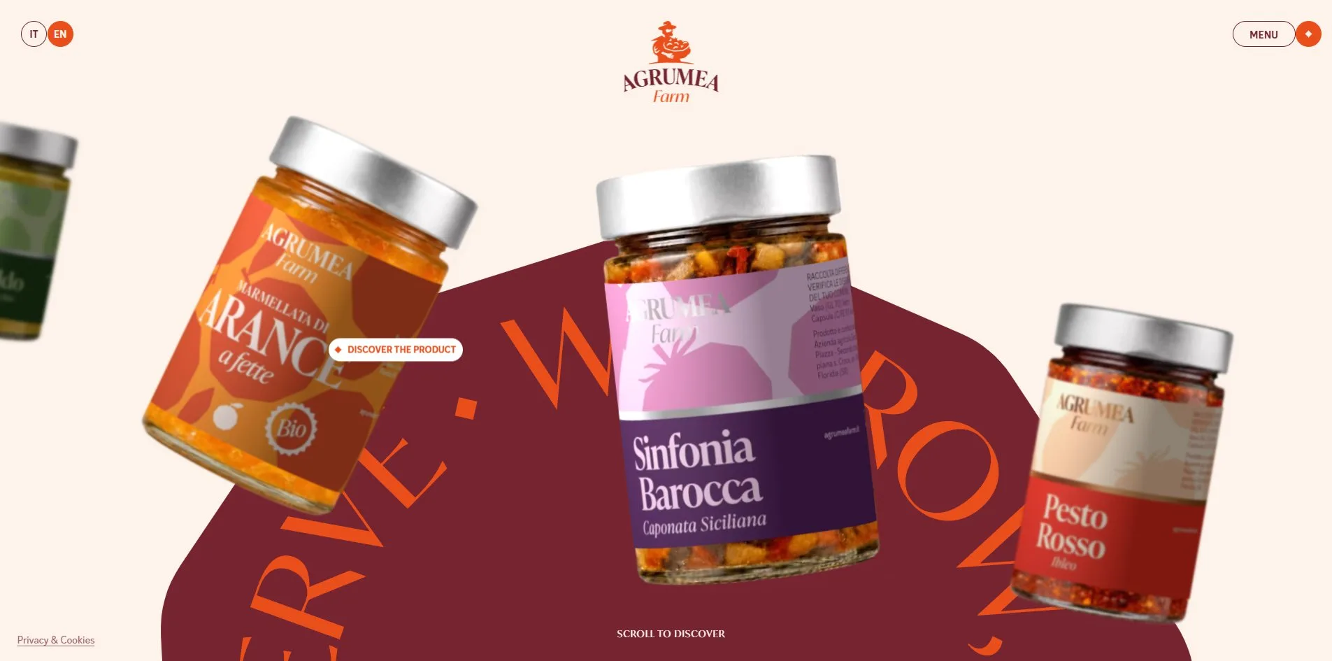 The same home page with the pointer resting on the orange marmalade jar on the left, a white pill label reading DISCOVER THE PRODUCT floating beside it, and the jar slightly larger than its neighbours.