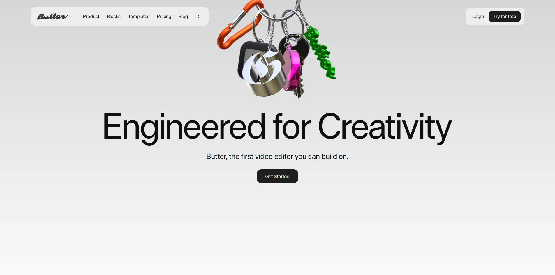The first screen, with a keychain hanging from the top of the page, an orange carabiner holding several silver chains that carry a black square tag set with a silver Gothic G, a pink disc, a chrome key and a green script Butter tag, the charms leaning slightly to the right, above the black headline Engineered for Creativity and a black Get Started button.