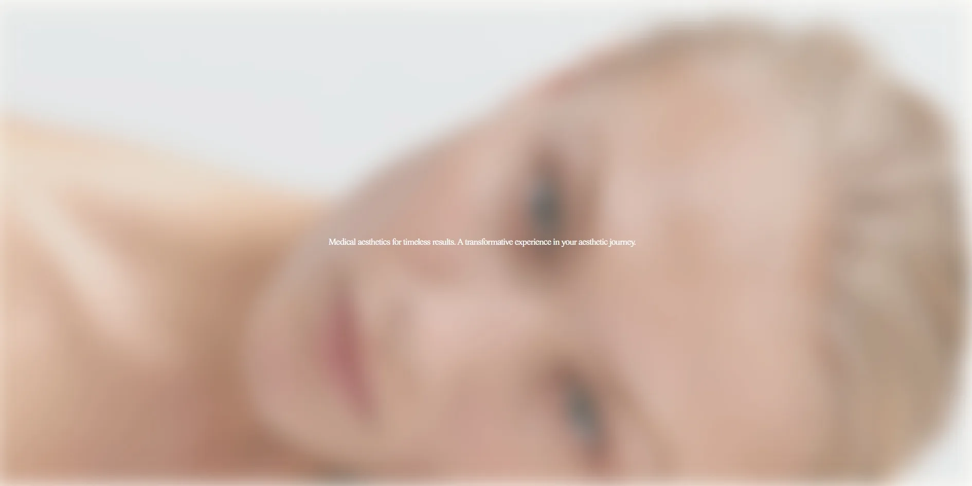 After ten minutes without any input, the home page is covered by a blurred portrait with one line of white tagline text in the middle